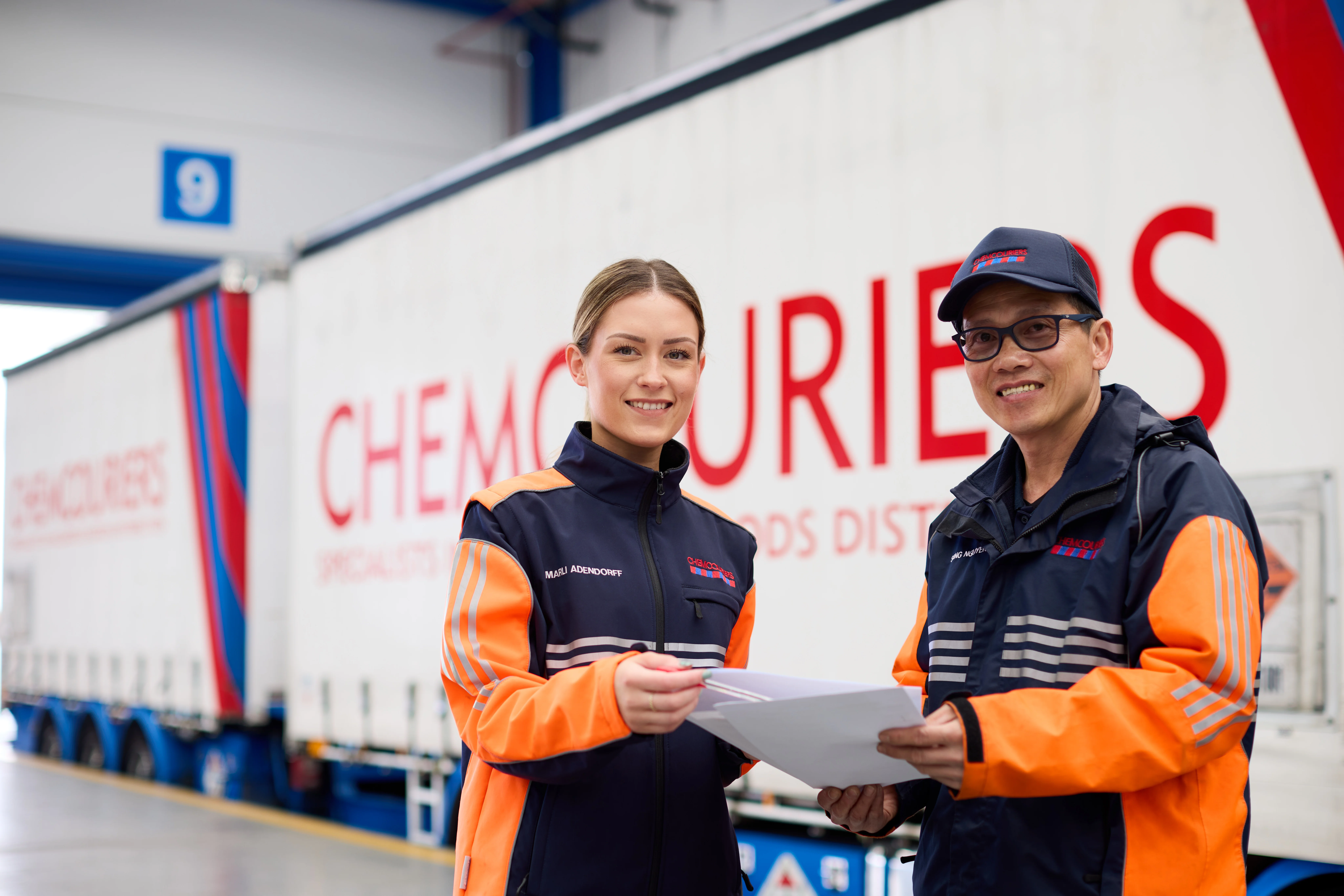 Two Chemcouriers team members wearing protective gear at a Dangerous Goods Depot